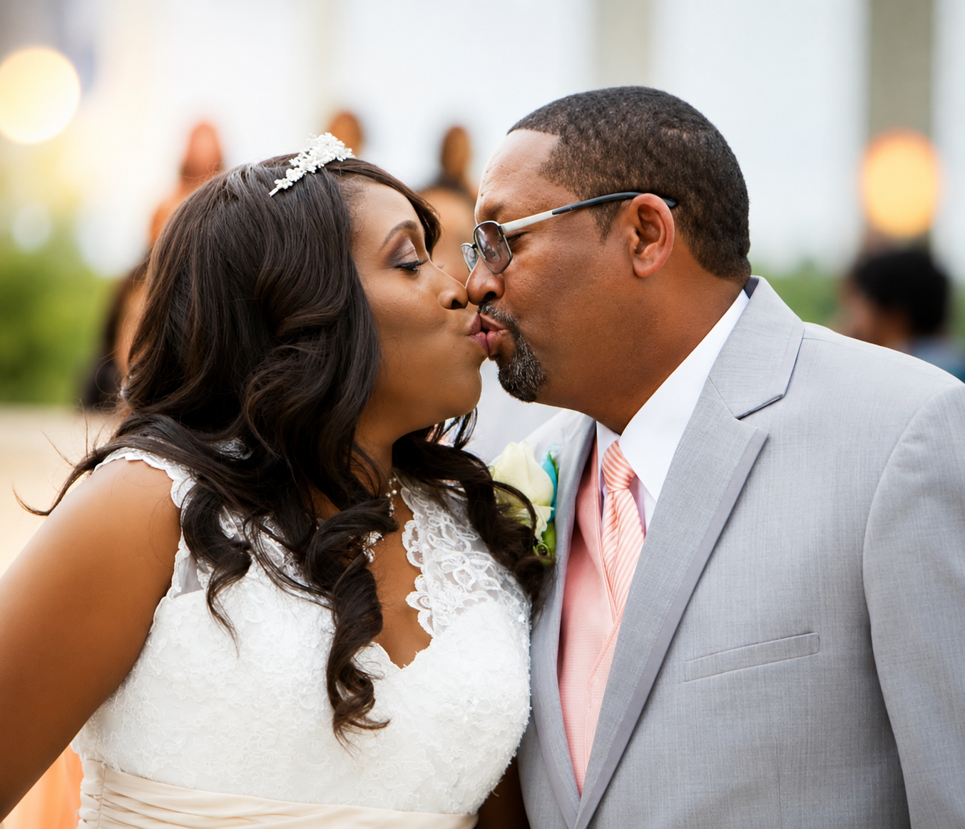 Bride and groom sharing a kiss at their wedding ceremony